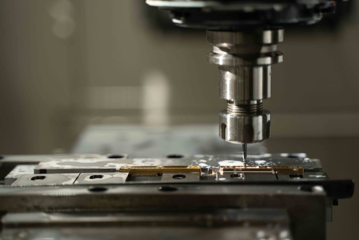 CNC milling machine cutting a precision tooling component at K-TOOL Engineering in Penang, Malaysia